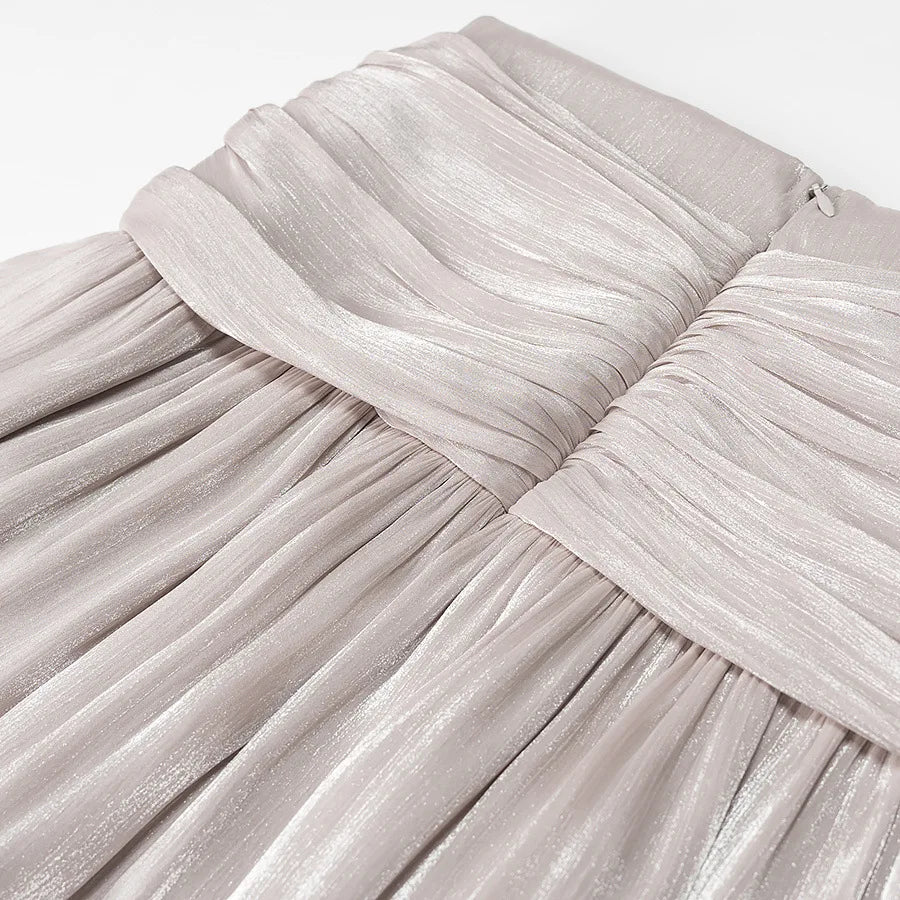 Conjunto Blusa e Saia Plissada - Brilho Sutil e Silhueta Moderna