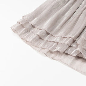 Conjunto Blusa e Saia Plissada - Brilho Sutil e Silhueta Moderna