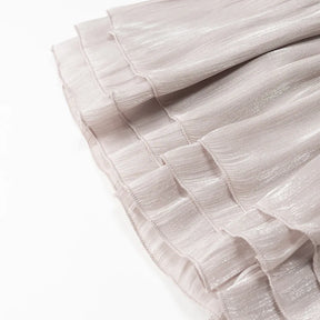 Conjunto Blusa e Saia Plissada - Brilho Sutil e Silhueta Moderna