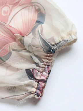 Vestido Longo Floral – Recortes Sofisticados, Manga Longa e Amarração nas Costas